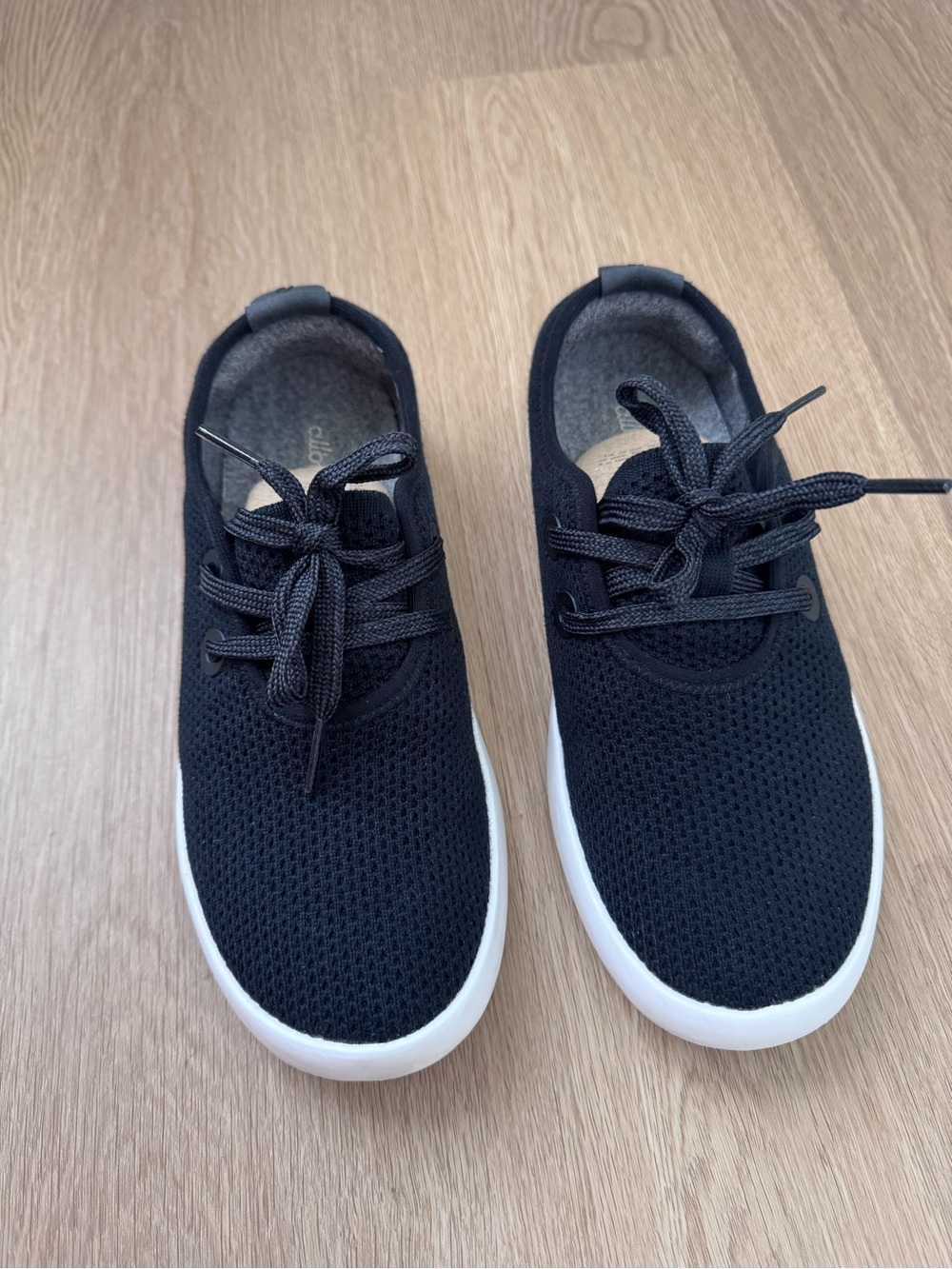 Allbirds Tree Skipper Slip-on Sneakers Women. Jet Black color. Boat shoe design.